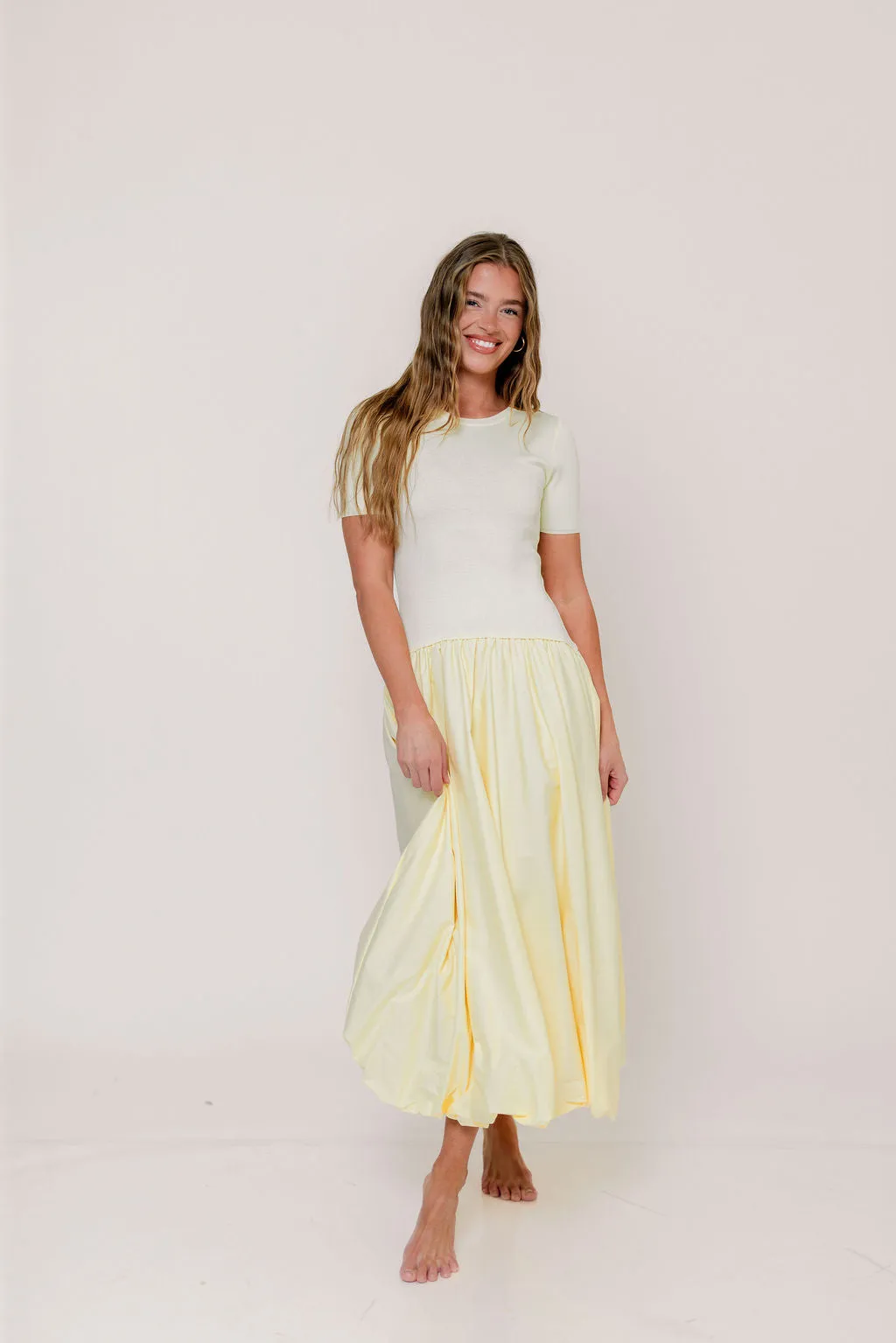 Zaniyah Bubble Skirt Midi Dress in Butter Yellow sold by Worth Collective
