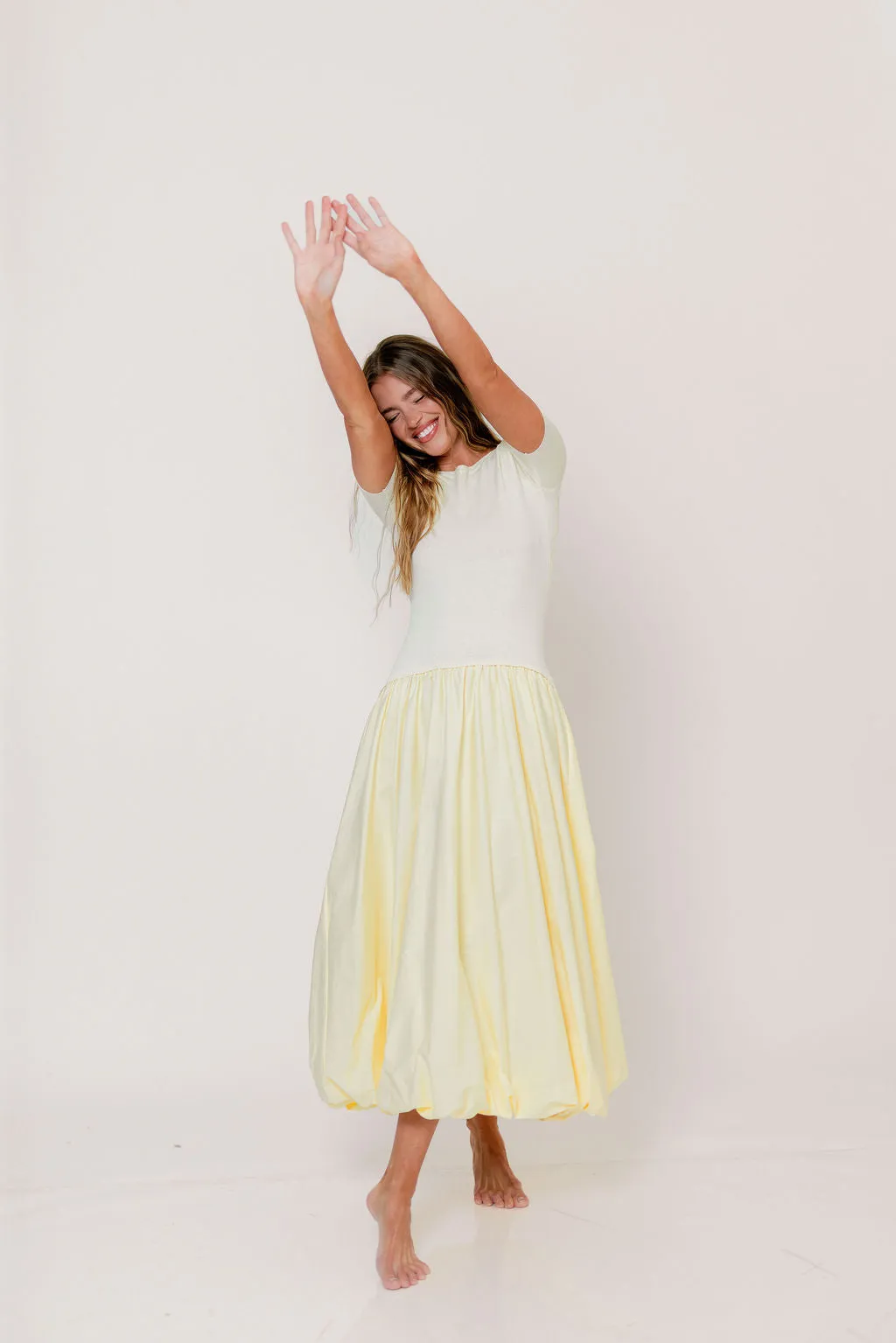 Zaniyah Bubble Skirt Midi Dress in Butter Yellow sold by Worth Collective product image thumbnail 5