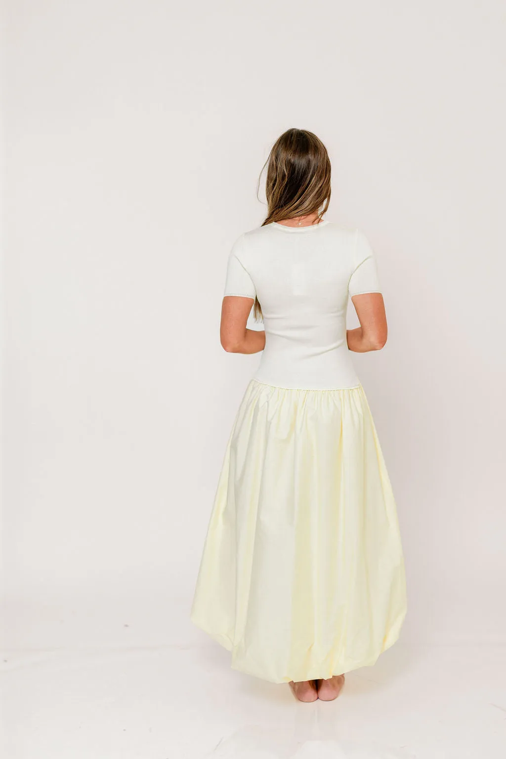 Zaniyah Bubble Skirt Midi Dress in Butter Yellow sold by Worth Collective product image thumbnail 2
