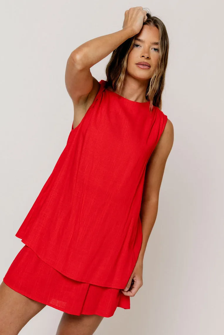 Serenity Linen Layered Twisted Shoulder Detail Mini Dress in Red sold by Worth Collective