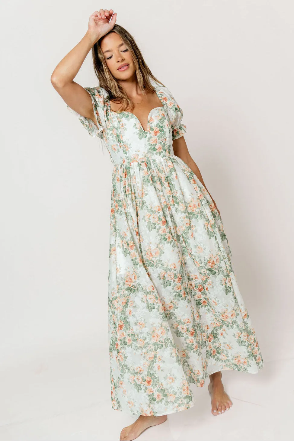 Raelynn Floral Maxi Dress in Cream/Dusty Peach sold by Worth Collective