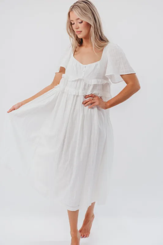 Madeline Empire Waisted Midi Dress with Ruffle Detail in Off-White sold by Worth Collective
