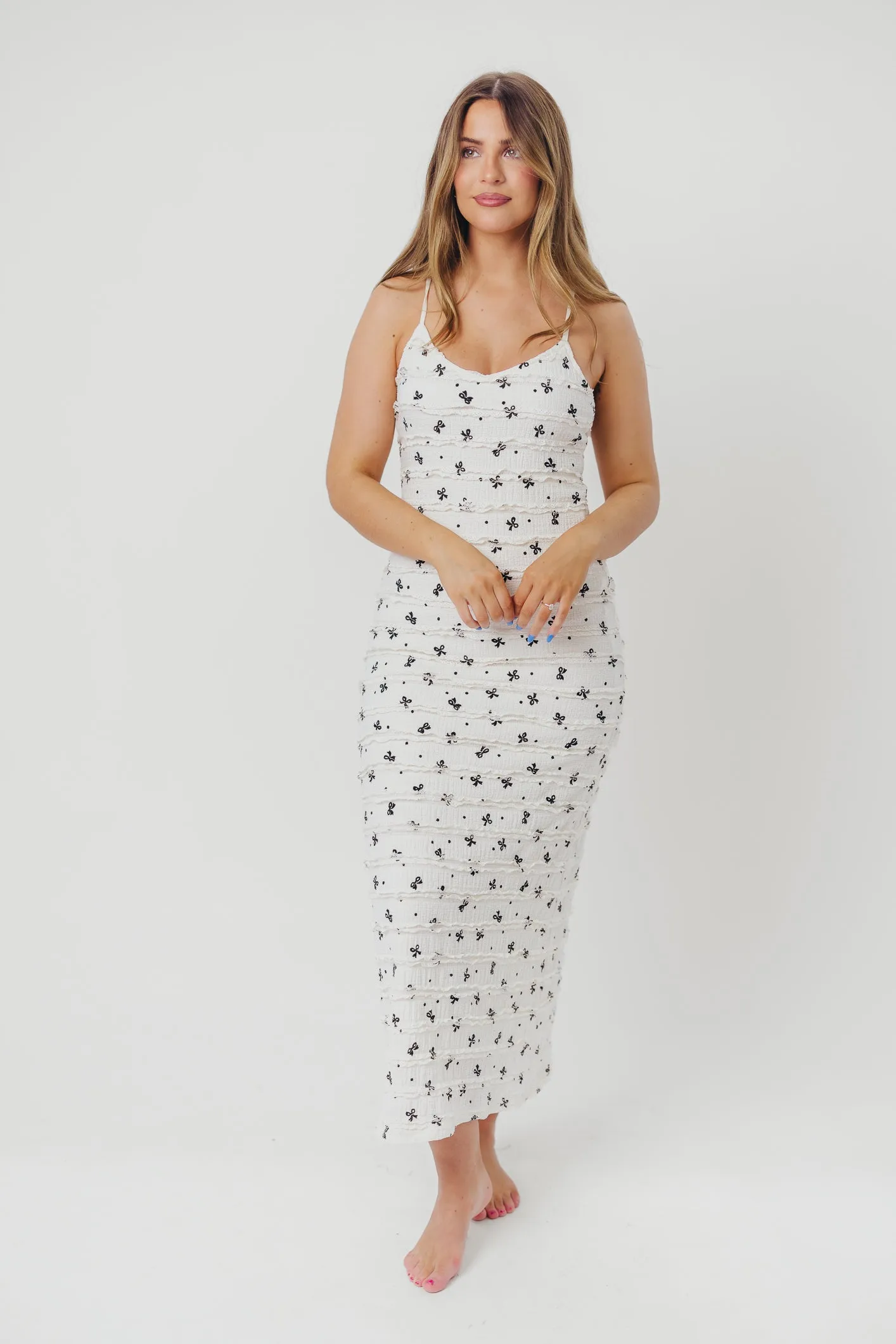 Piper Bow Print Maxi Dress with Ruffles in Ivory sold by Worth Collective