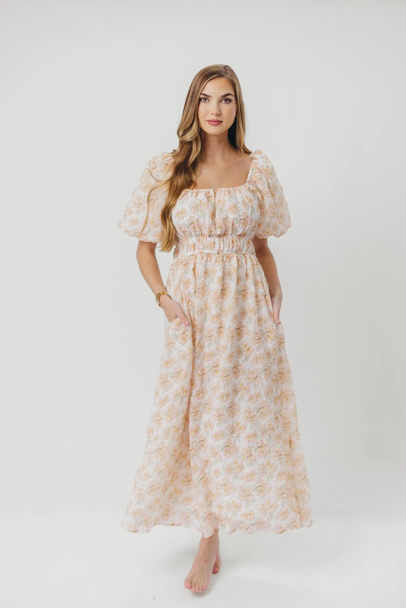 Mallory Textured Print Midi Dress in Tangerine Floral sold by Worth Collective