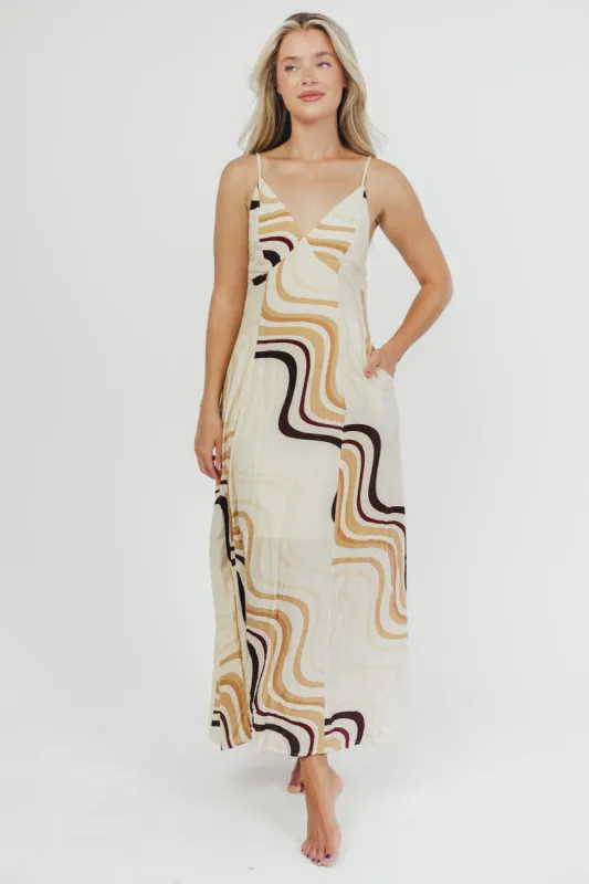Raelynn Printed Open Back Maxi Dress in Natural sold by Worth Collective