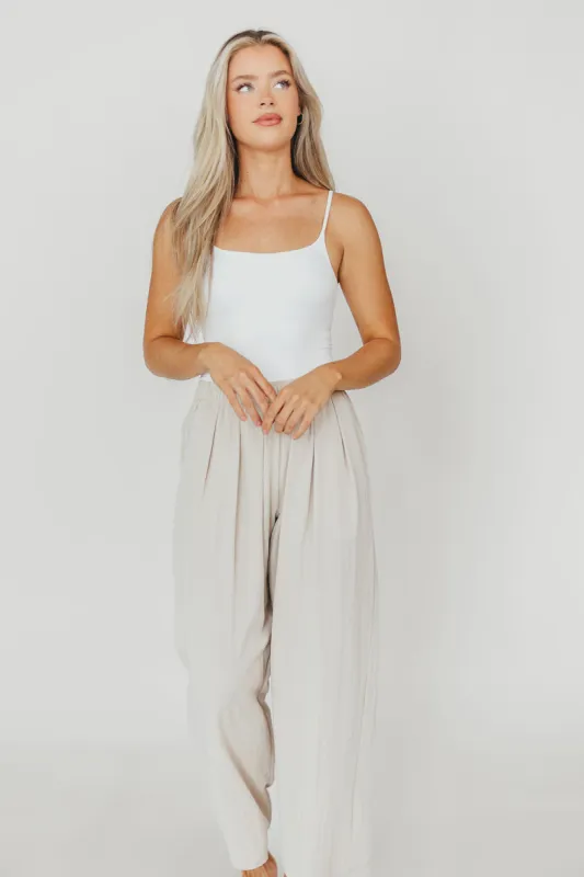 Make a Move Bodysuit in White sold by Worth Collective