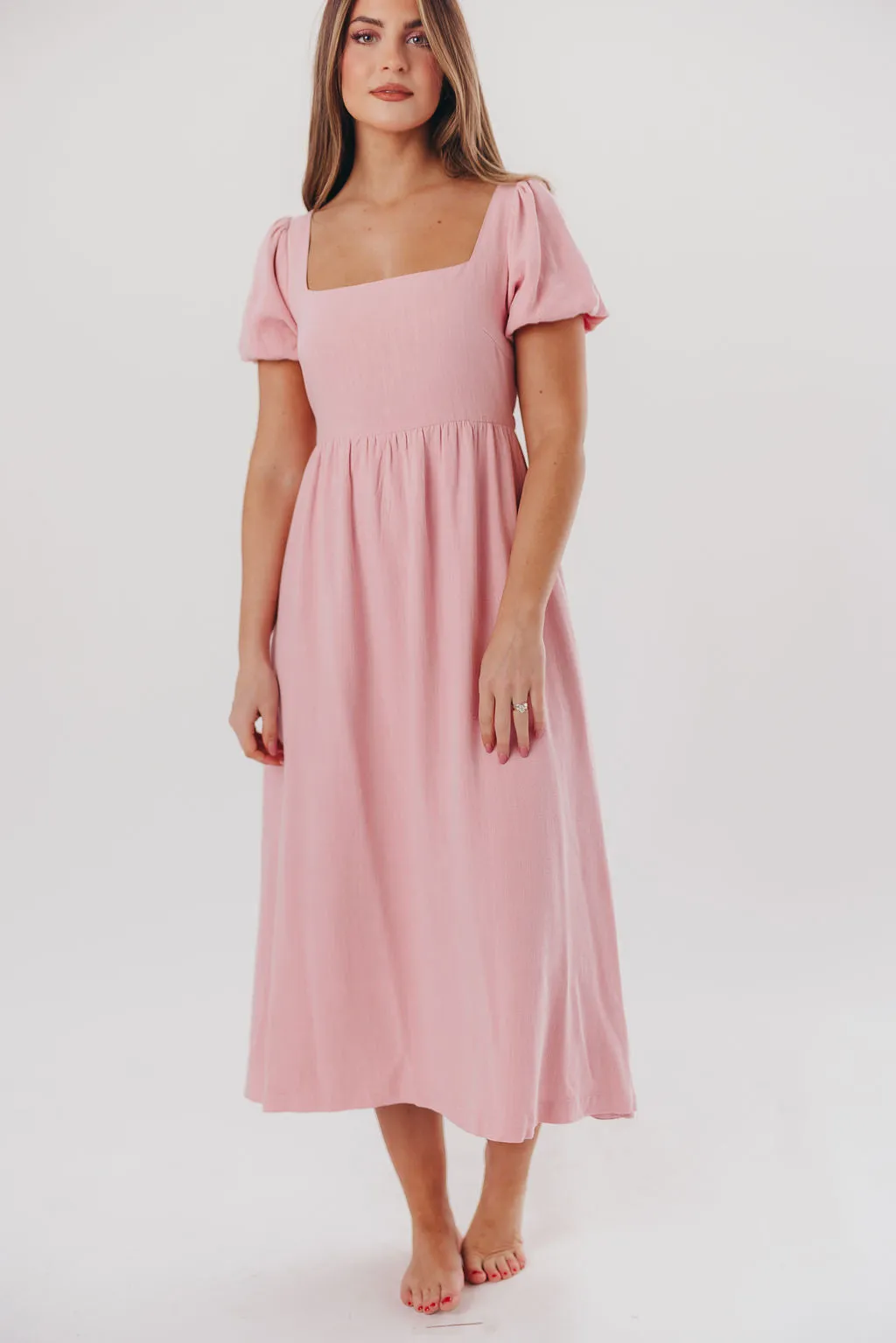 Ainsley Square Neck Midi Dress with Puffed Sleeves in Bright Blush - Bump Friendly & Inclusive Sizing (S-3XL) sold by Worth Collective
