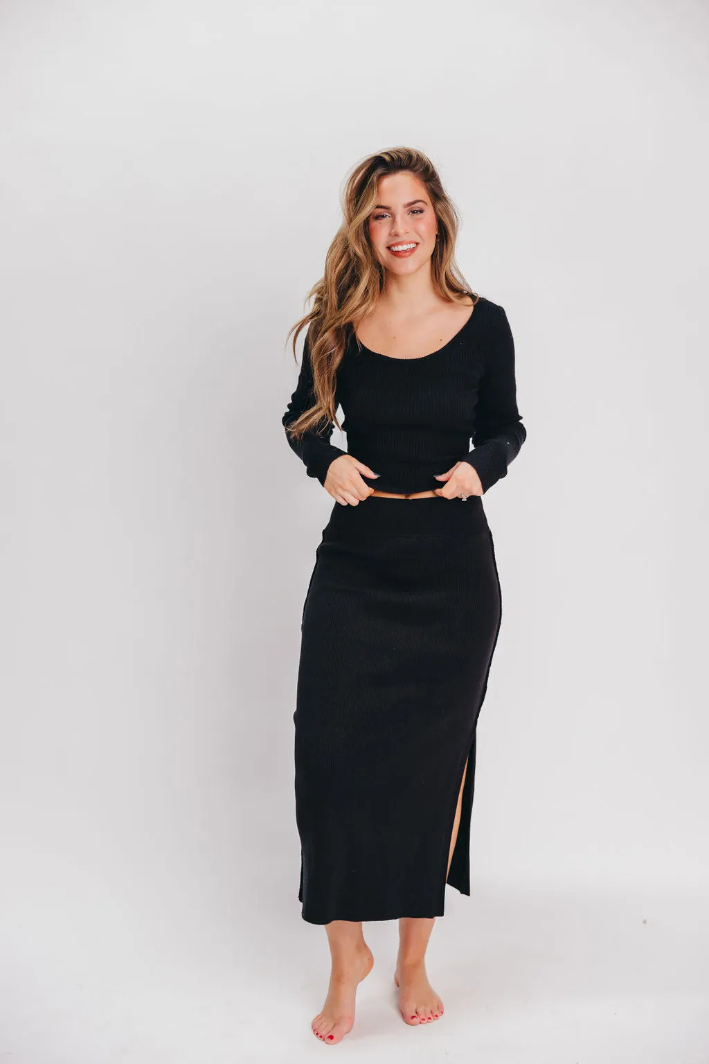 Julia Ribbed Midi Skirt in Black sold by Worth Collective