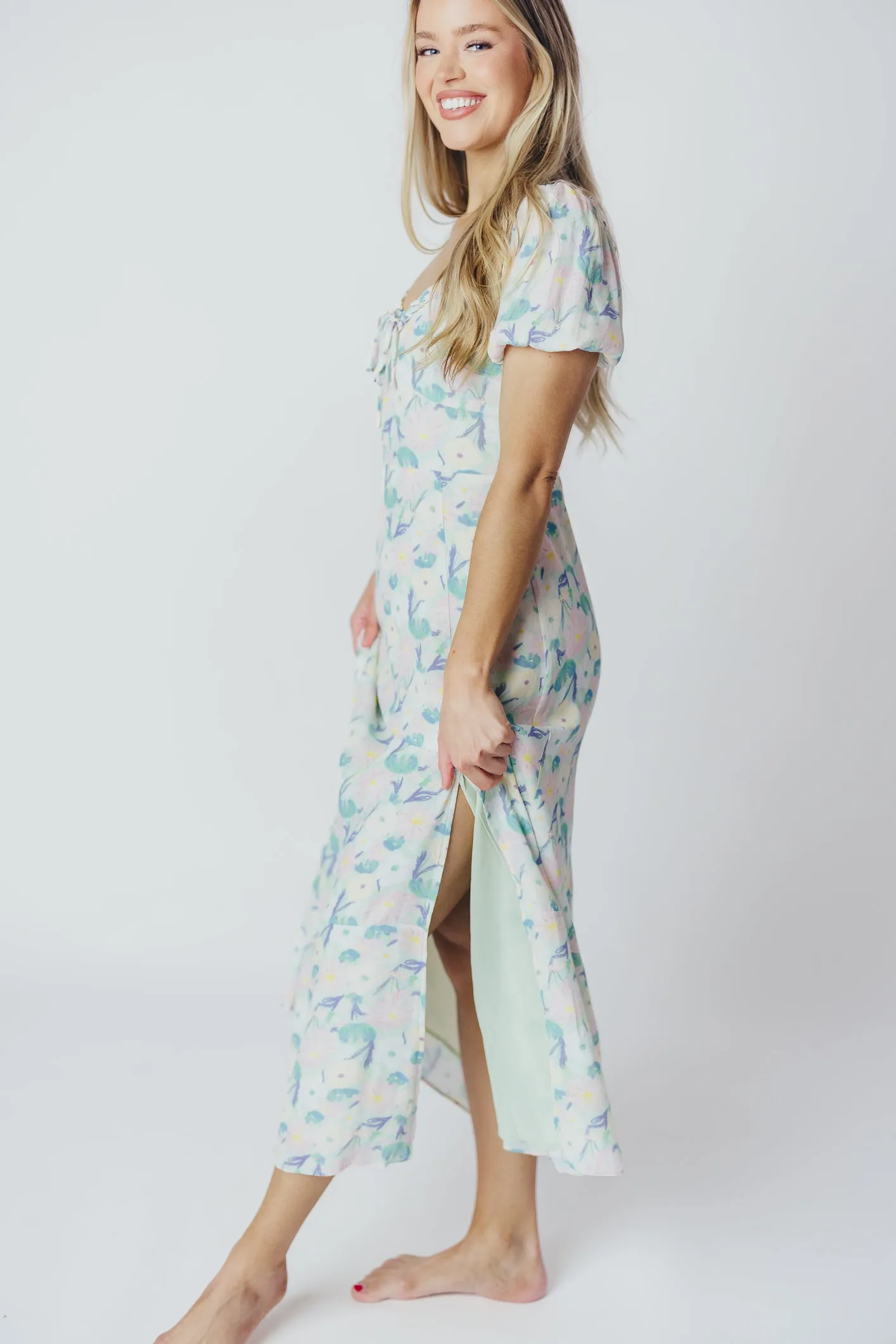 ASTR Madeline Puffed Sleeve Midi Dress in Purple/Mint Floral (XS-XL) sold by Worth Collective product image thumbnail 5