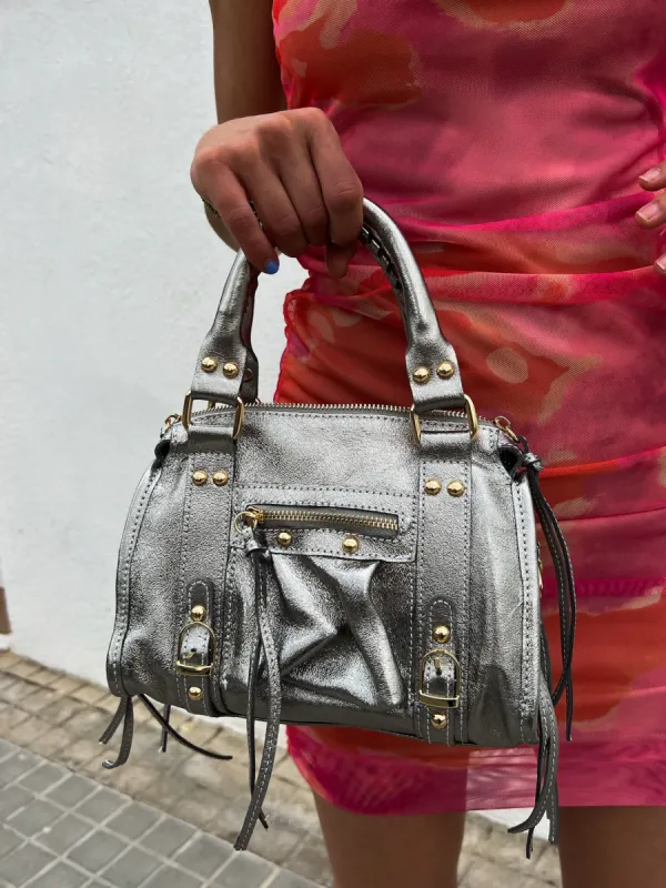 Bolso hebillas piel brillos plata sold by Sorellas