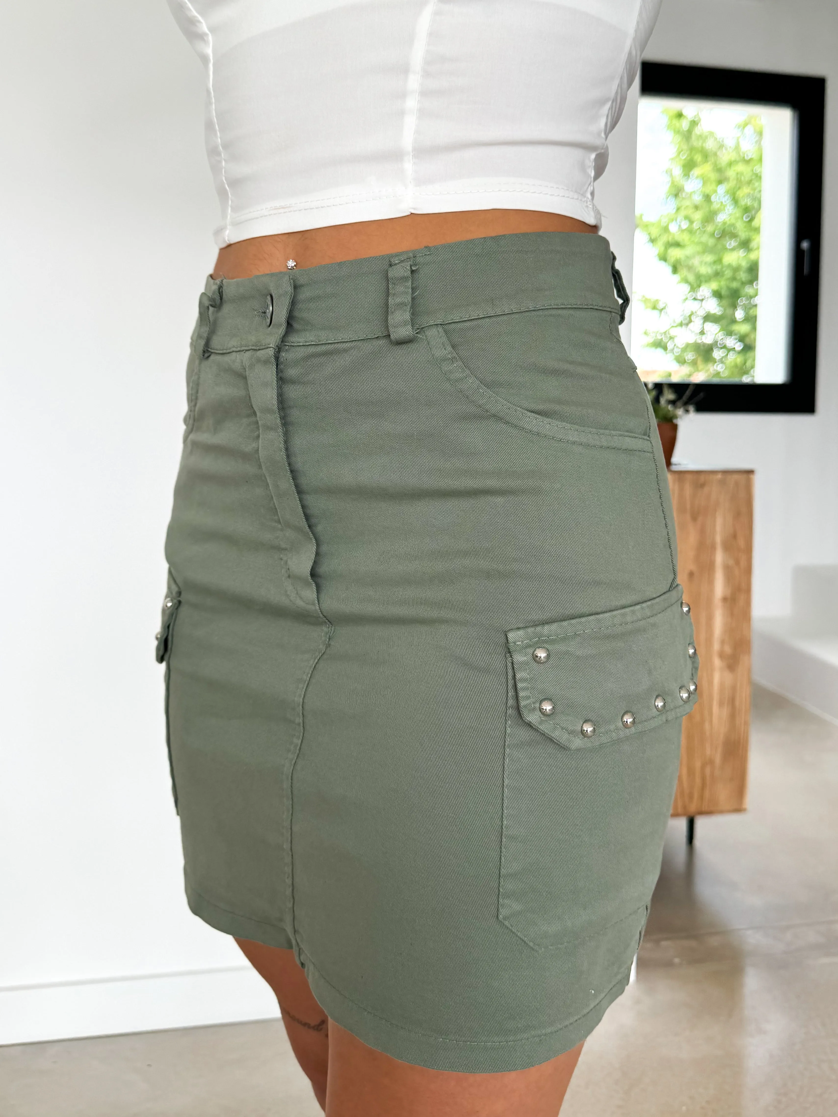 Falda mini tachuelas caqui sold by Sorellas