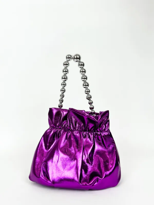 Clutch saco perlas lila sold by Sorellas