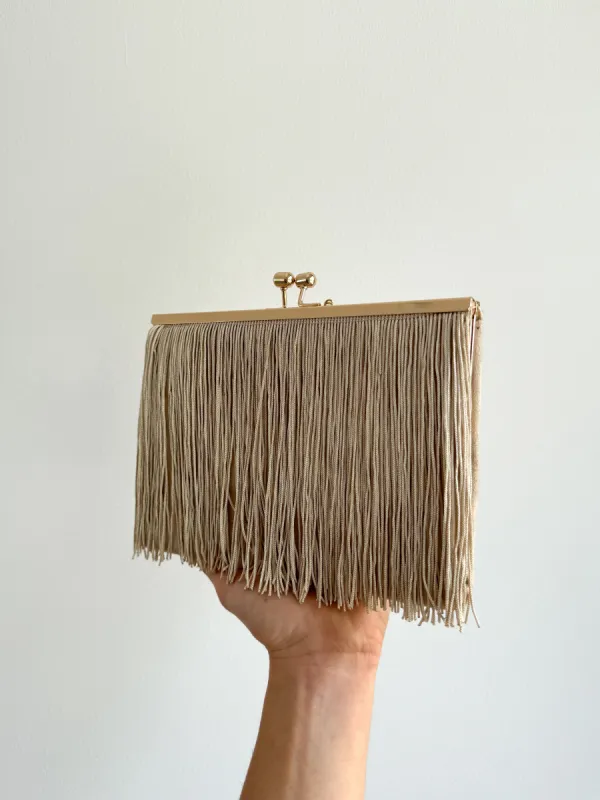 Clutch ante flecos beige sold by Sorellas