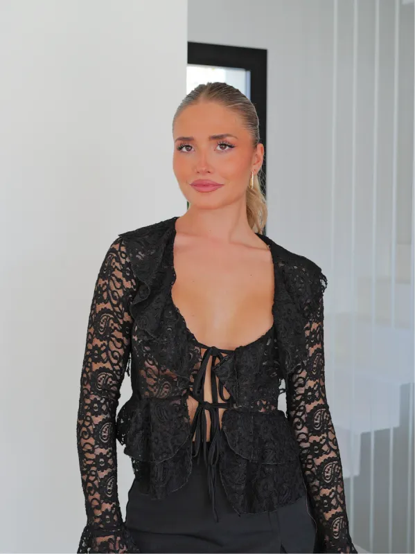 Blusa volantes encaje negro sold by Sorellas
