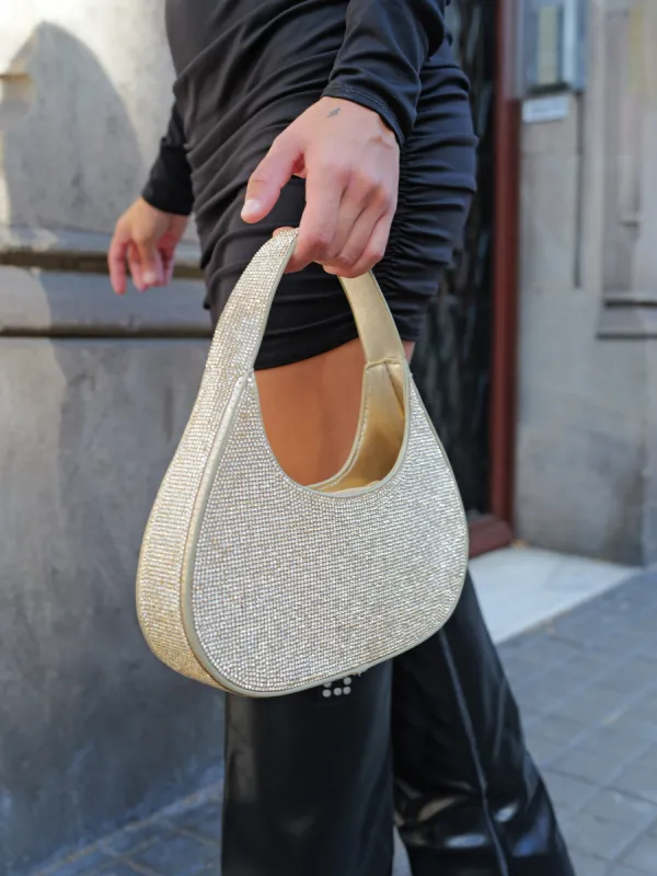 Bolso mano brillos dorado sold by Sorellas