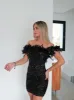 Vestido mini plumas glitter negro sold by Sorellas
