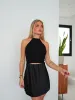 Top halter lurex negro sold by Sorellas