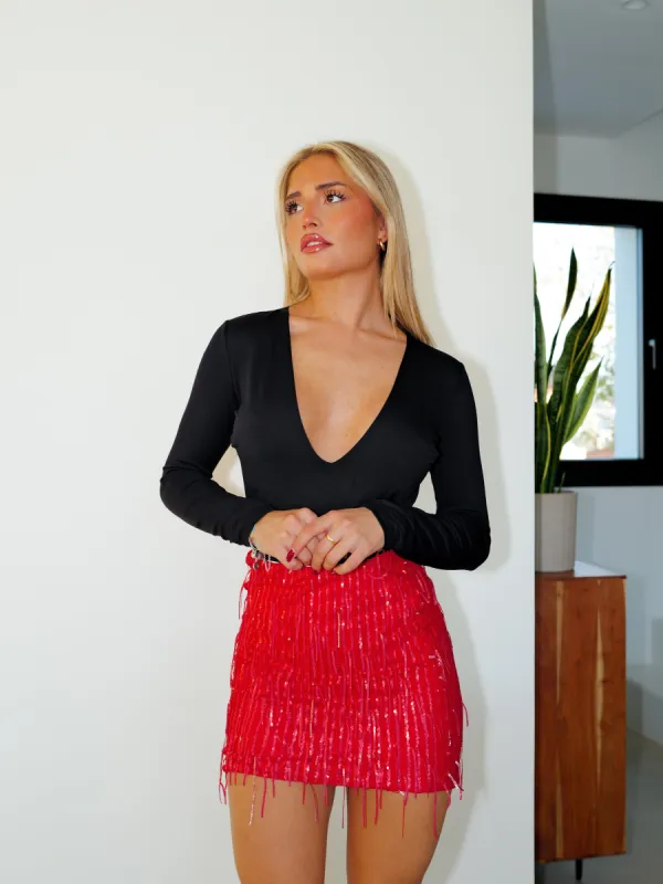 Falda mini glitter flecos rojo sold by Sorellas