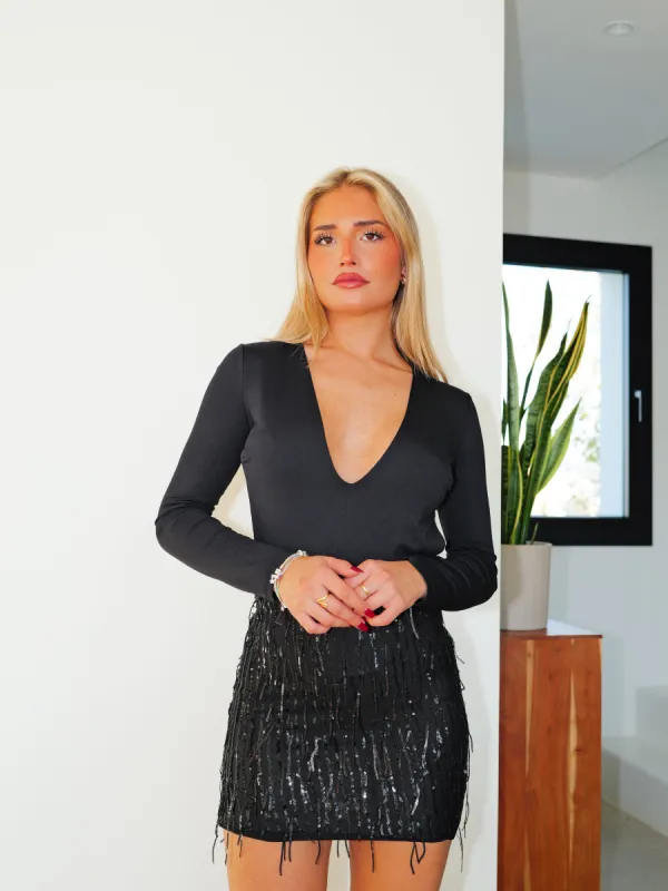 Falda mini glitter flecos negra sold by Sorellas