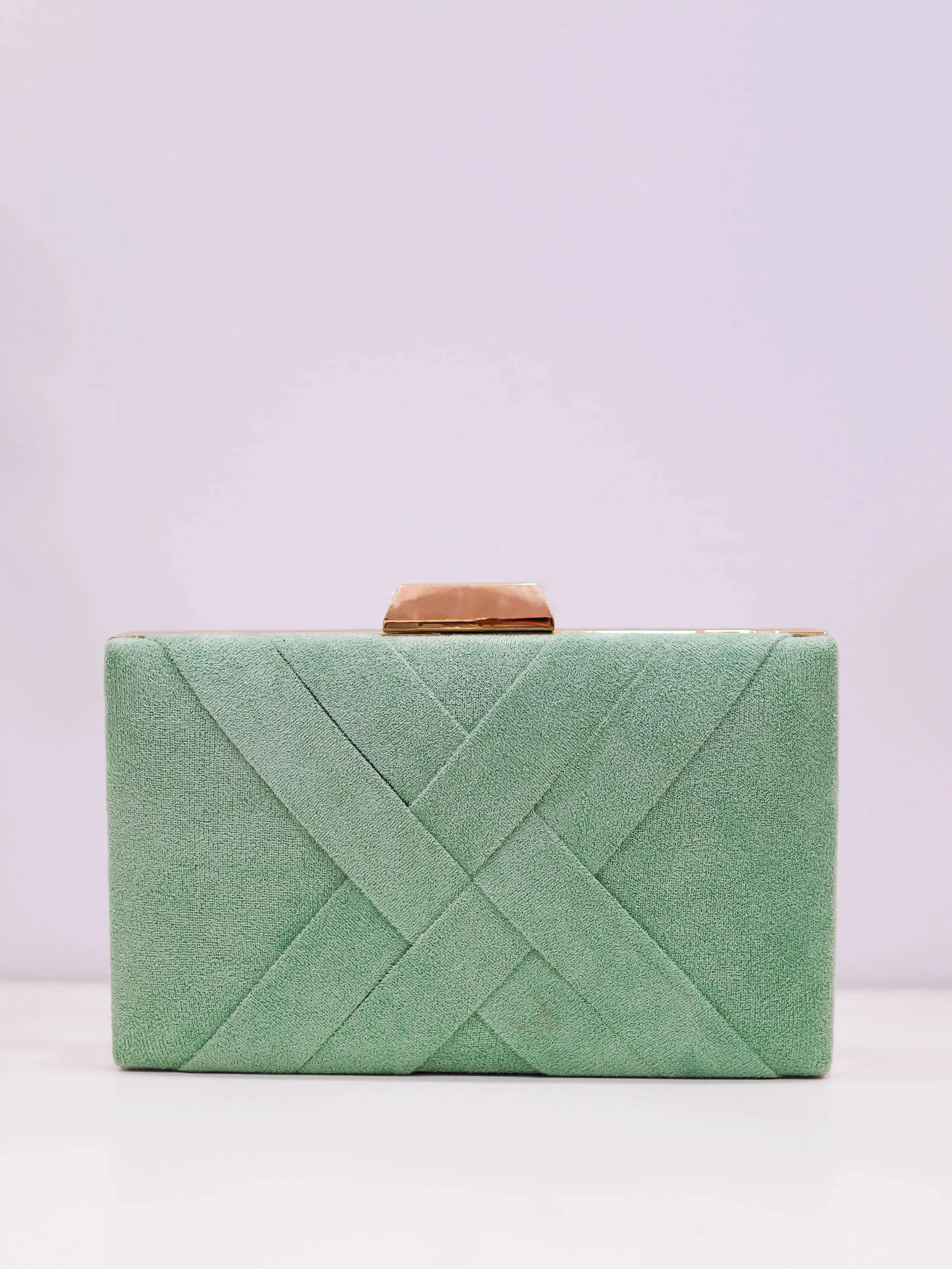 Clutch trenzado menta sold by Sorellas