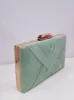 Clutch trenzado menta sold by Sorellas