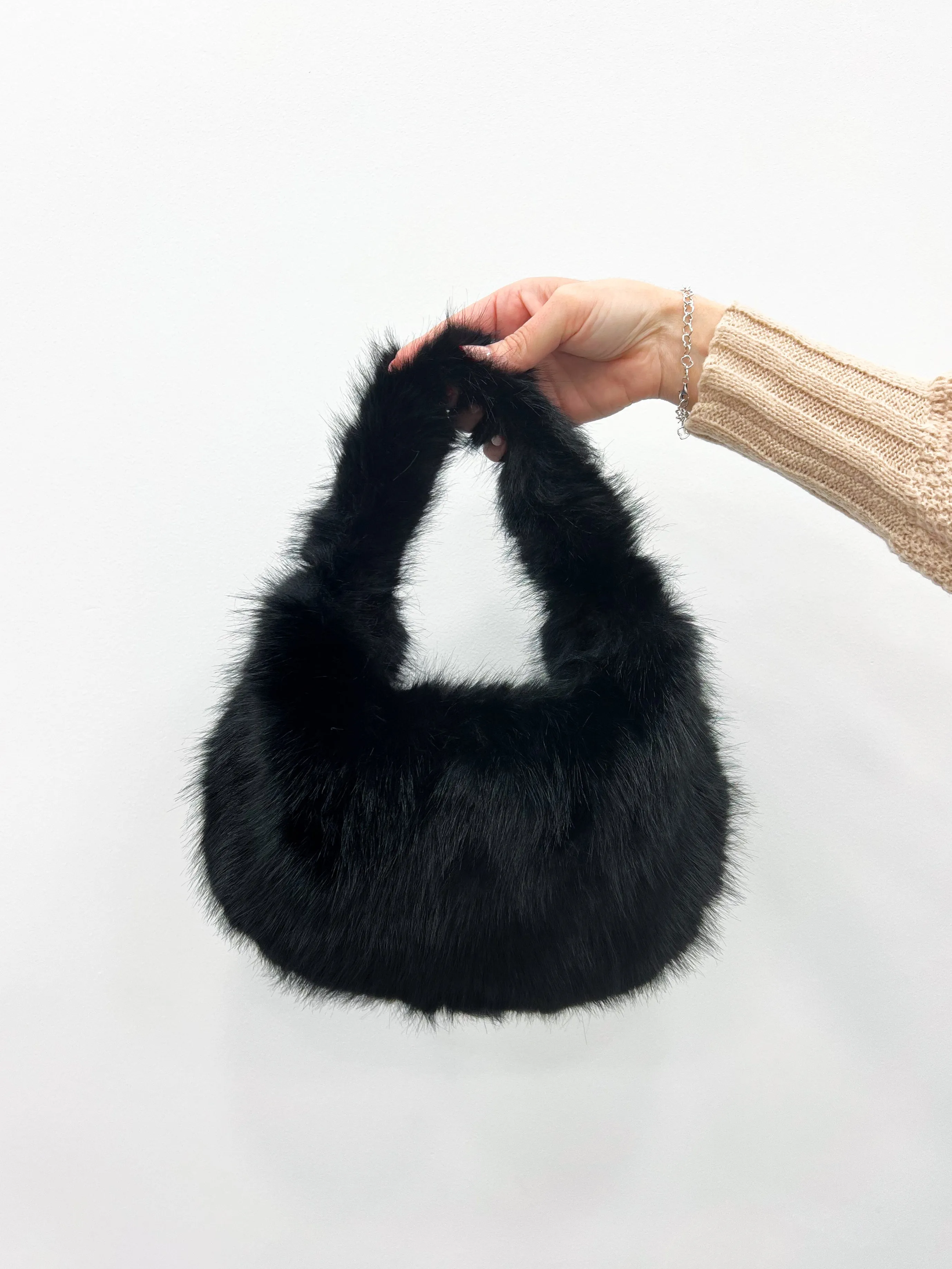 Bolso pelo negro sold by Sorellas