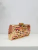 Clutch bandas colores dorado sold by Sorellas