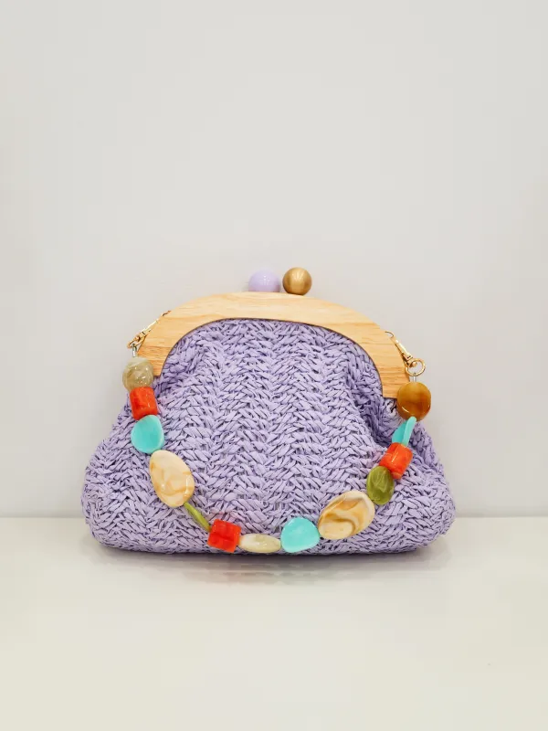 Clutch rafia abalorios lila sold by Sorellas