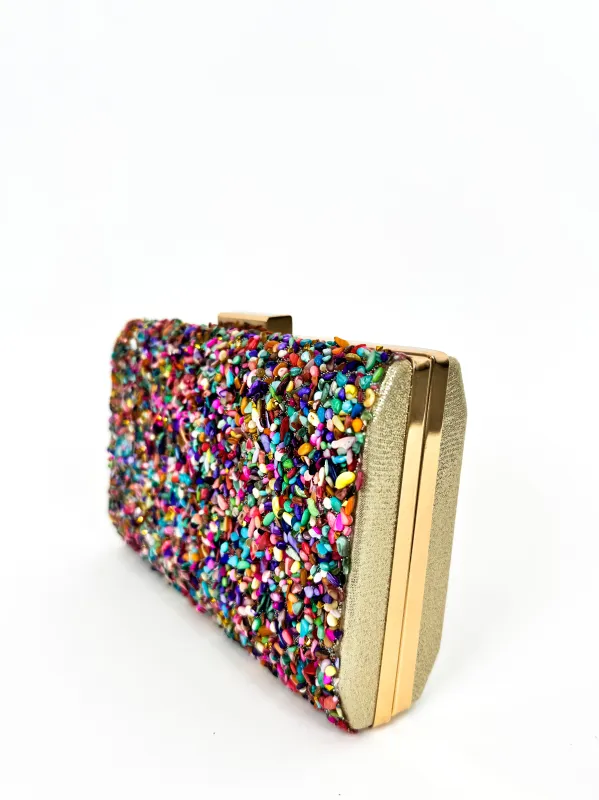 Clutch horizontal piedras colores sold by Sorellas