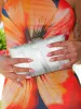 Clutch bandas textura plata sold by Sorellas