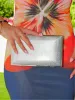 Clutch textura plateado sold by Sorellas