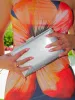 Clutch textura plateado sold by Sorellas