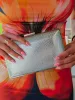 Clutch textura plateado sold by Sorellas