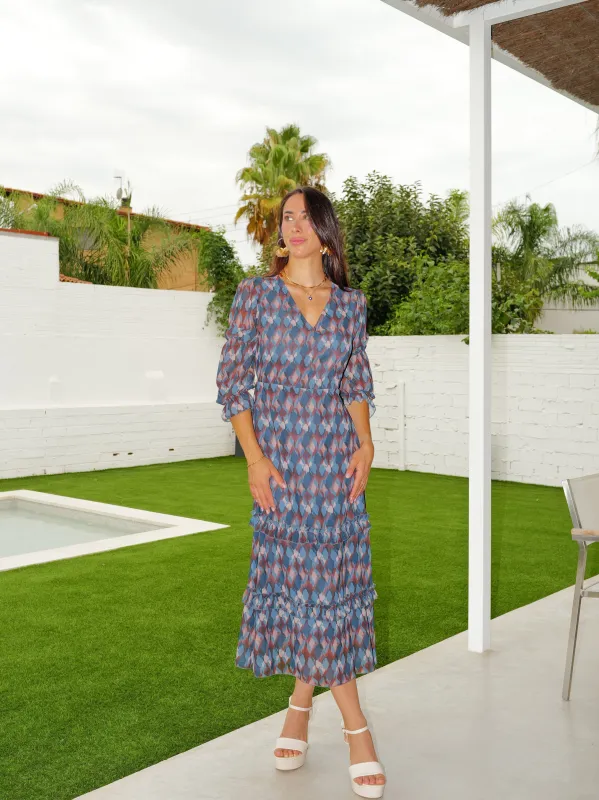 Vestido midi pico volantes petróleo sold by Sorellas