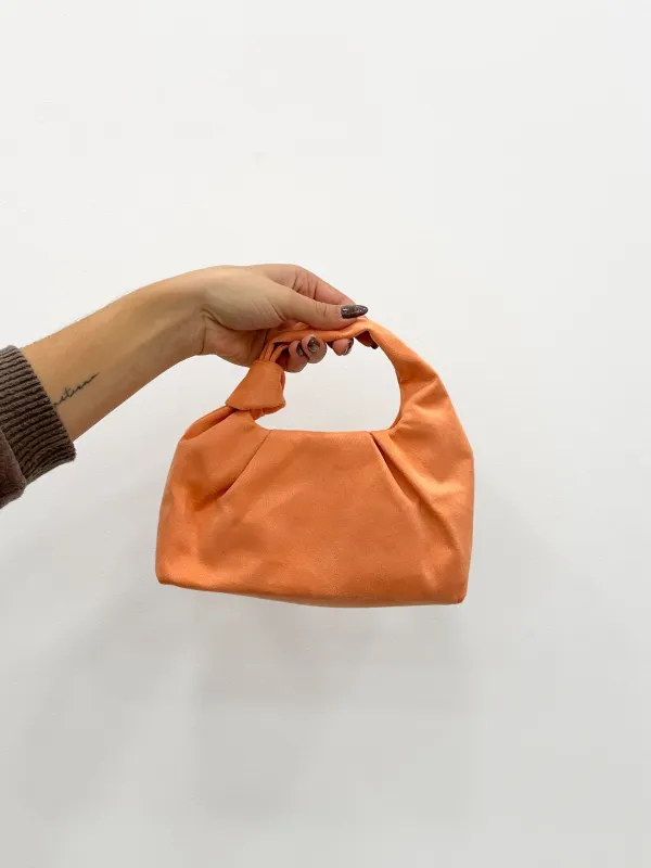 Clutch ante nudo salmon sold by Sorellas