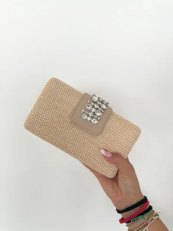 Clutch banda piedras sold by Sorellas