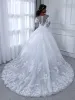Sheer Neck Long Sleeves Tulle Ball Gown Wedding Dresses with Beading Appliques sold by Lavetir