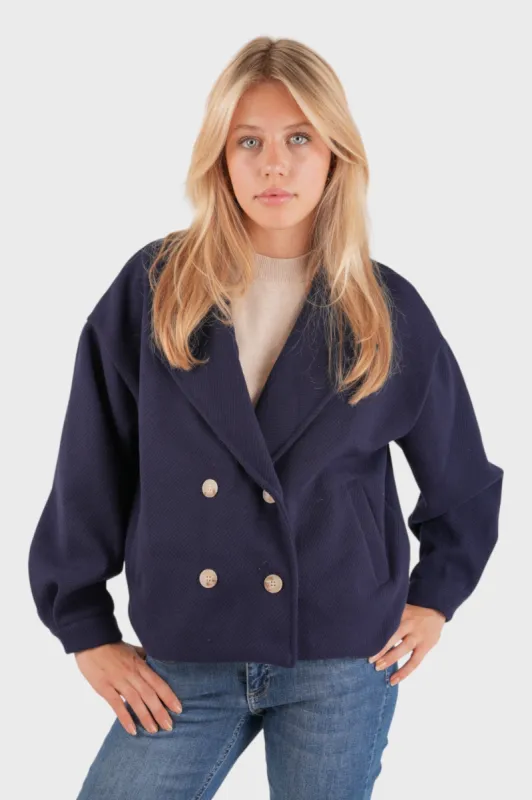 “Scandi” coat blue sold by Meet Me There