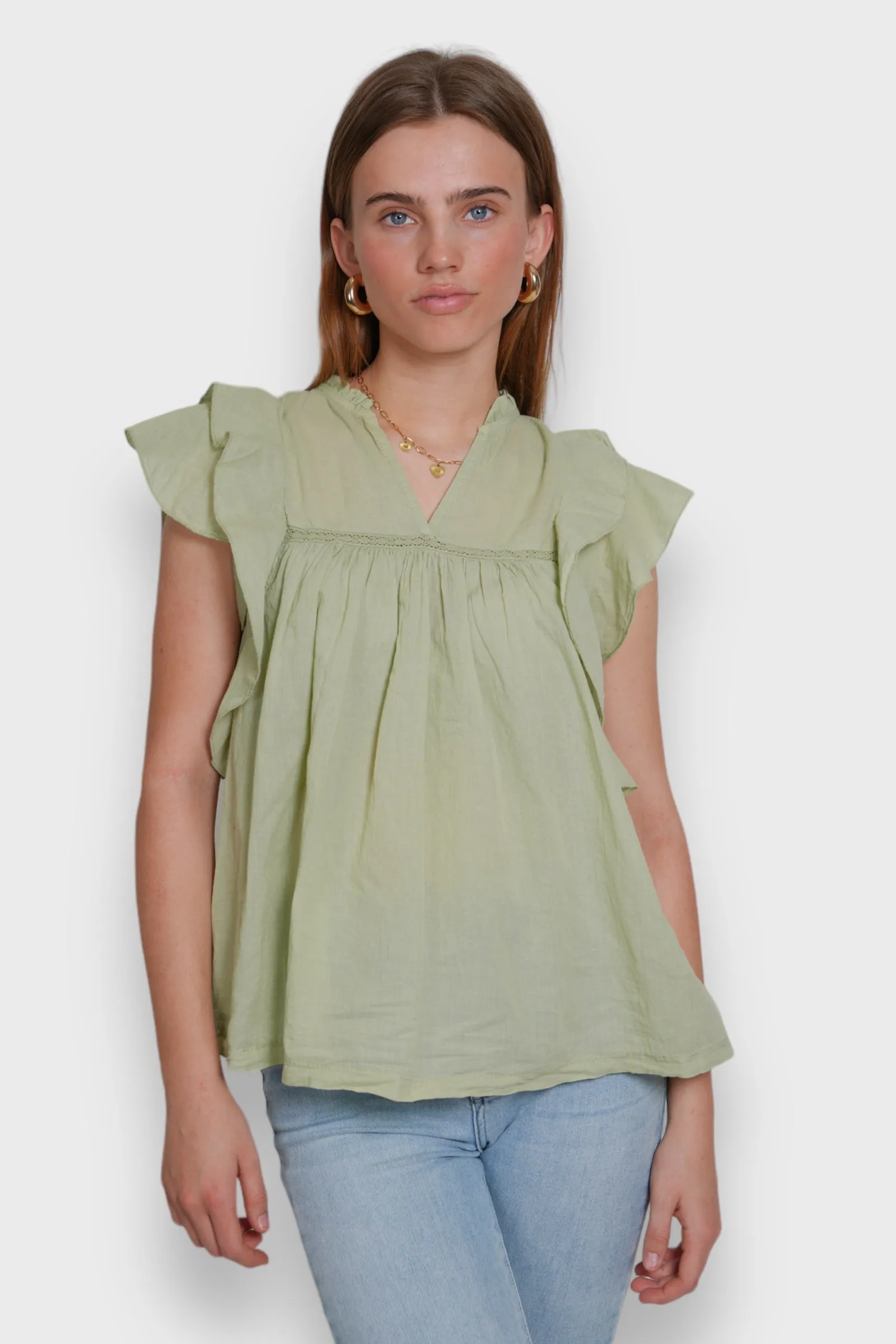 "Flora" blouse sage green sold by Meet Me There