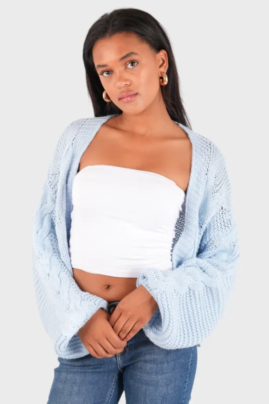 "Cable" vest light blue sold by Meet Me There