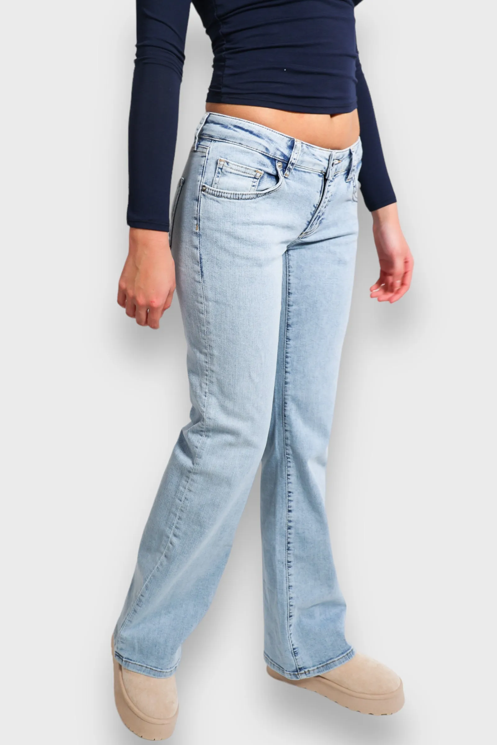 "Flared" low waist jeans light blue sold by Meet Me There