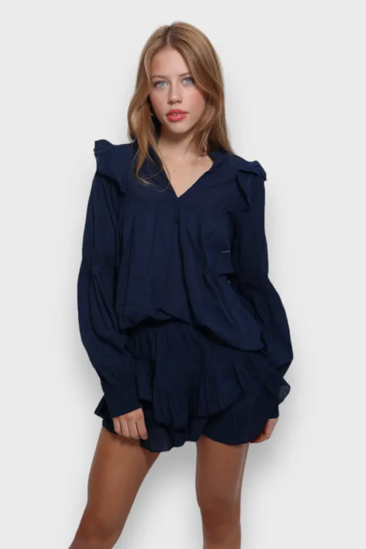 "Dots" skort navy sold by Meet Me There