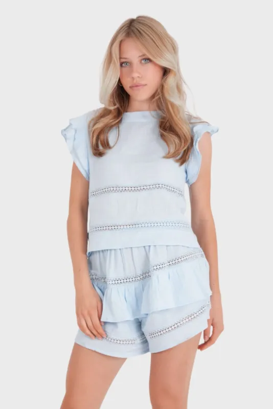 "Junies" top light blue sold by Meet Me There