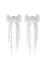 "Shiny bow" earrings silver sold by Meet Me There