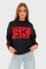 "Ski" sweater red sold by Meet Me There