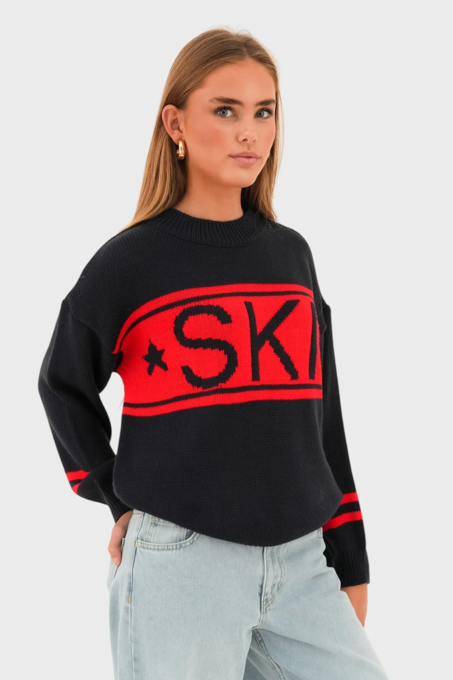 "Ski" sweater red sold by Meet Me There