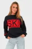 "Ski" sweater red sold by Meet Me There