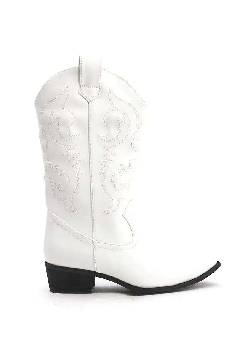 "Cowboy" boots white sold by Meet Me There