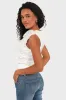 "Glow" top white sold by Meet Me There