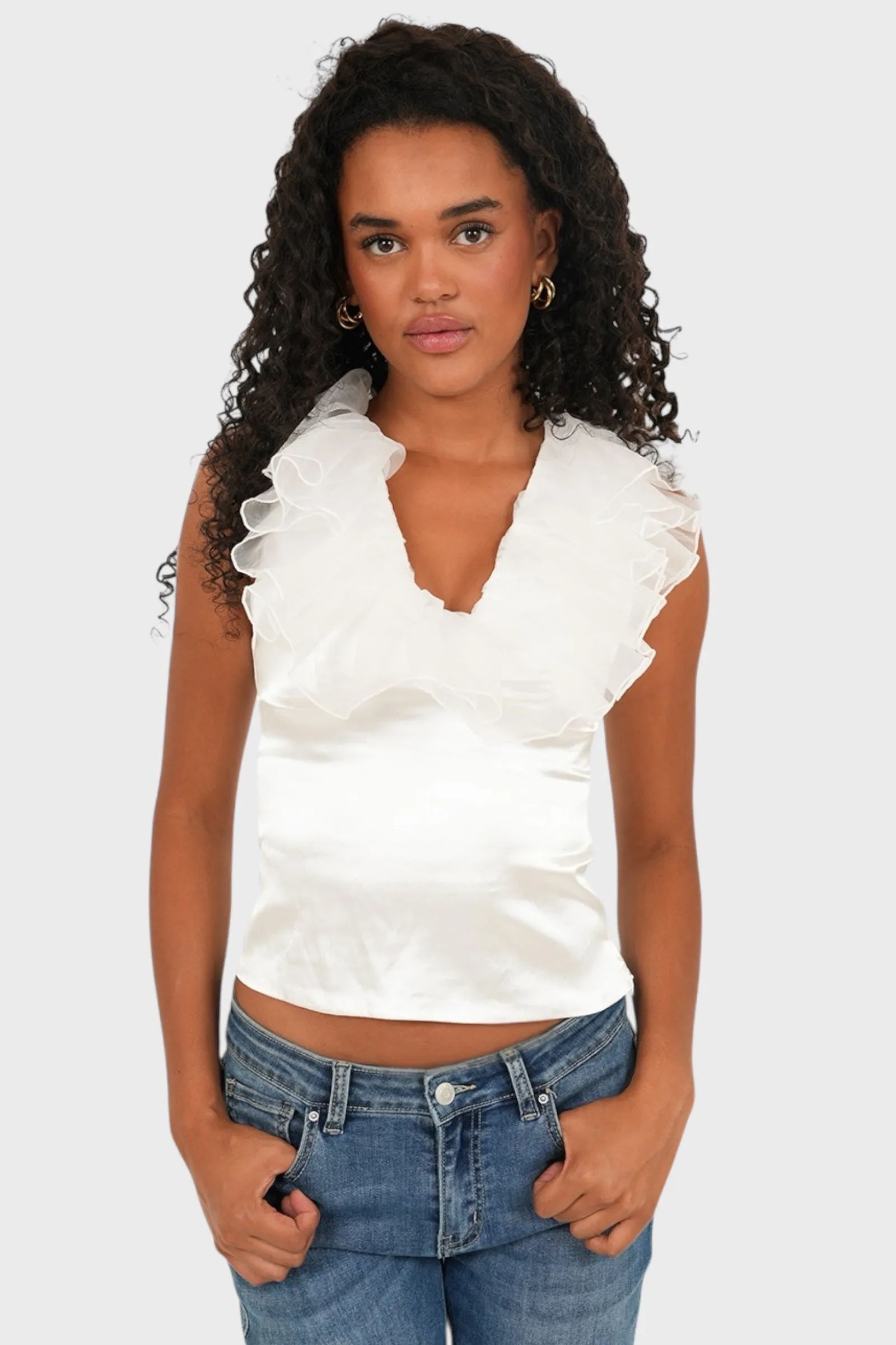 "Glow" top white sold by Meet Me There